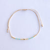 Add a pop of subtle color to your style with our Gleam Beads Adjustable Bracelets. Featuring different colors and gold beads on a silky cotton string, these adjustable bracelets are perfect for layering, with five colors available to create your unique combinations. Lightweight and comfortable, they’re ideal for everyday wear and special occasions alike. Don't forget to check our matchy anklets too!