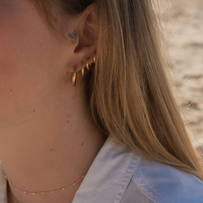 These Classic Hoops are available in both silver and gold and in a range of sizes and widths, so you can create your perfect earring combination. Don't forget to check our thinner version too.
