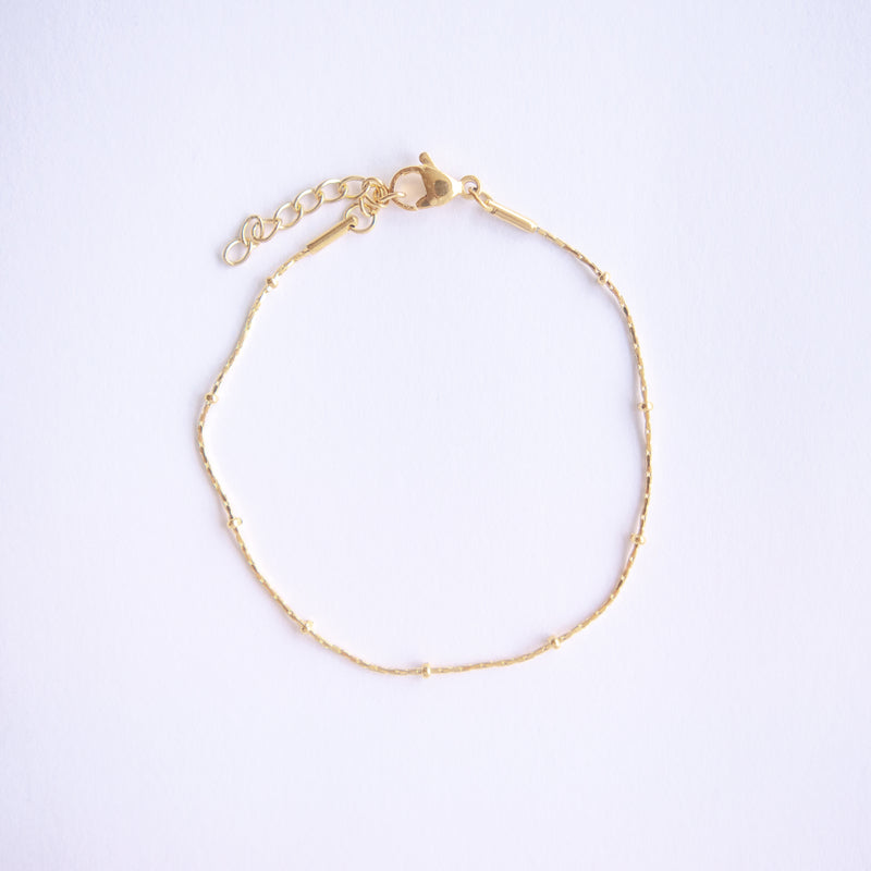 Explore timeless jewelry with our Gold Plated Stainless Steel Sparkle Dots Bracelet. Crafted for durability and style, it's the perfect accessory for any occasion. Get yours today and elevate your look effortlessly. Available also in silver color.