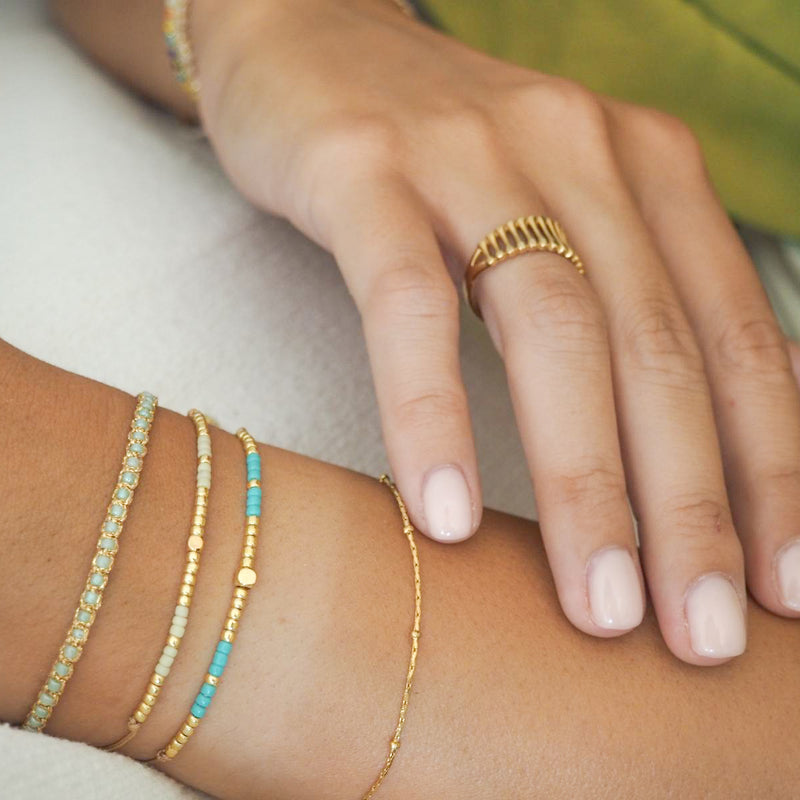 Explore timeless jewelry with our Gold Plated Stainless Steel Sparkle Dots Bracelet. Crafted for durability and style, it's the perfect accessory for any occasion. Get yours today and elevate your look effortlessly. Available also in silver color.