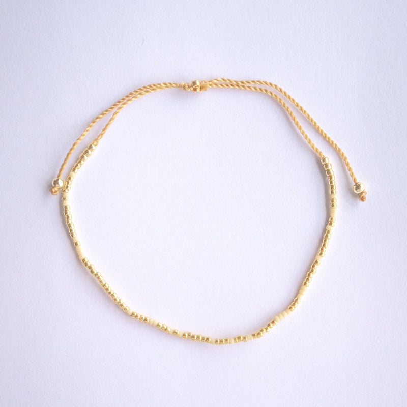 Add a pop of subtle color to your style with our Solo Beads Anklets. Featuring colorful and gold beads on an adjustable nylon string, these anklets are perfect for layering as we have five different colors available. Lightweight and comfortable, they’re ideal for everyday wear and special occasions alike.