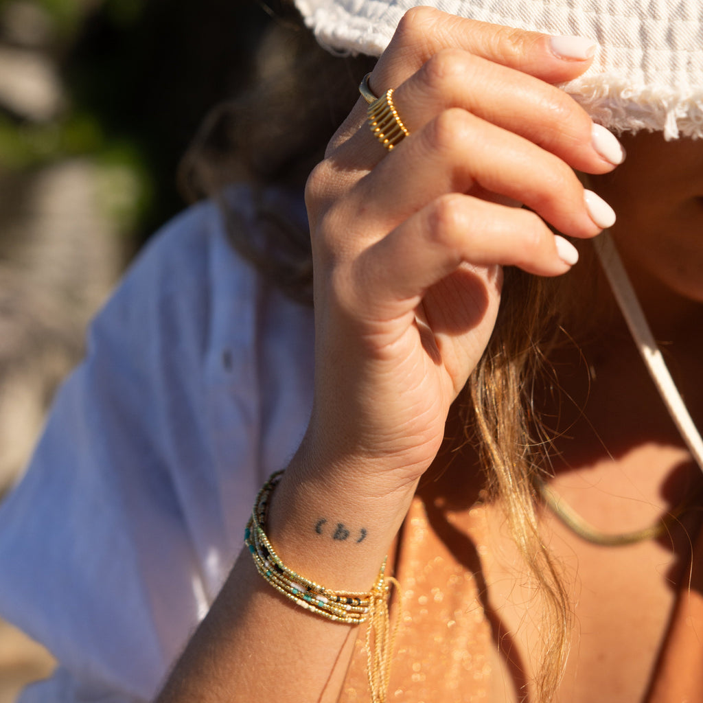 Add a pop of subtle color to your style with our Solo Beads Bracelets. Featuring different colors and gold beads on an adjustable nylon string, these bracelets are perfect for layering as we have five colors available. Lightweight and comfortable, they’re ideal for everyday wear and special occasions alike.
