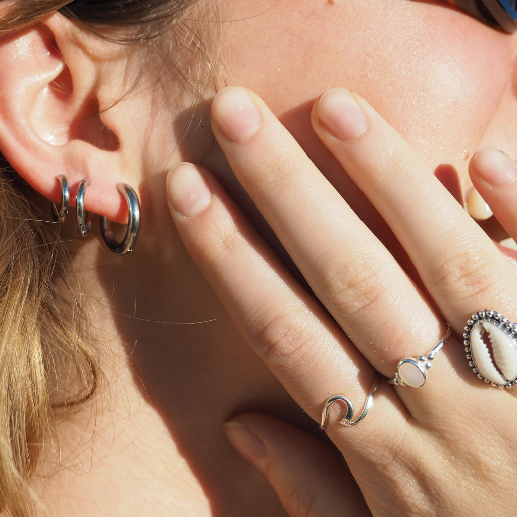 These Classic Hoops are available in both silver and gold and in a range of sizes and widths, so you can create your perfect earring combination. Don't forget to check our thinner version too.
