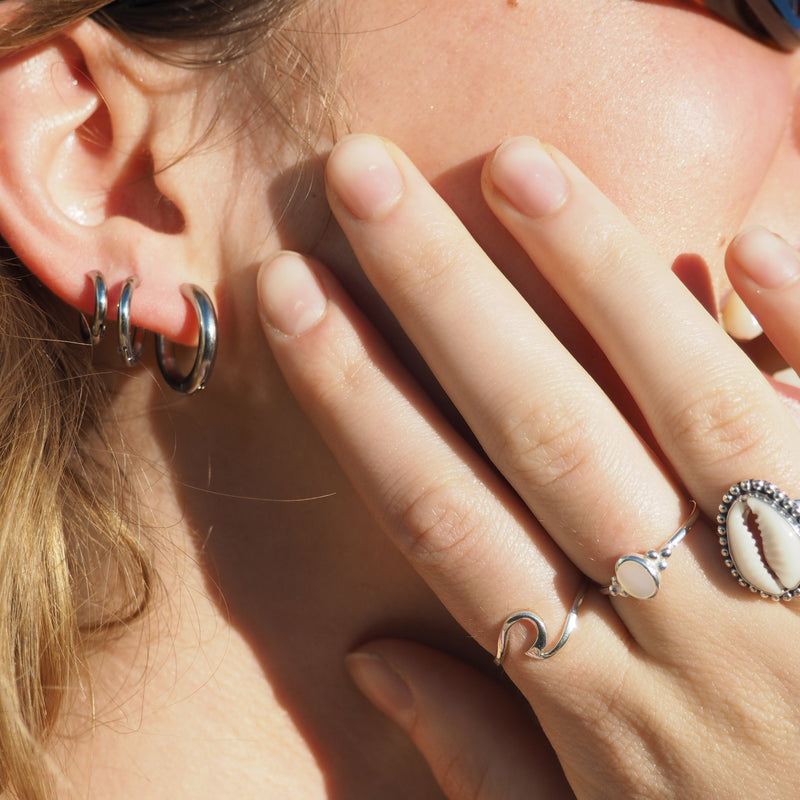 These Classic Hoops are available in both silver and gold and in a range of sizes and widths, so you can create your perfect earring combination. Don't forget to check our thinner version too.