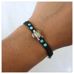 Hand made bracelet with turtle pendant on black cord with blue beads