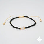 Single pearl bracelet with black beads
