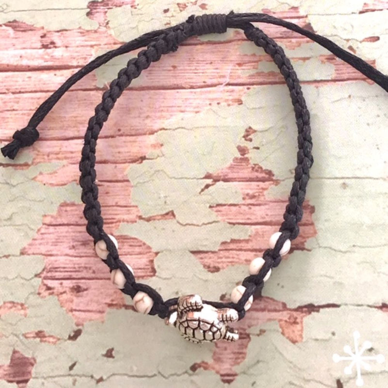 Hand made bracelet with turtle pendant on black cord with cream beads