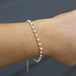 GOld bracelet with white bohemian beads