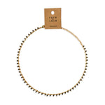 Gold necklace with black beads