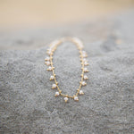 Gold bracelet with peach bohemian beads