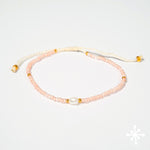 Single pearl bracelet with peach beads