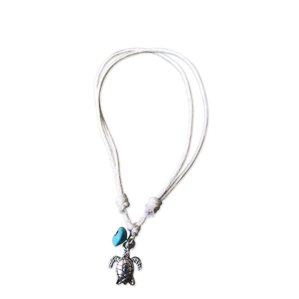 Turtle anklet with Turquoise charm on a cream cord